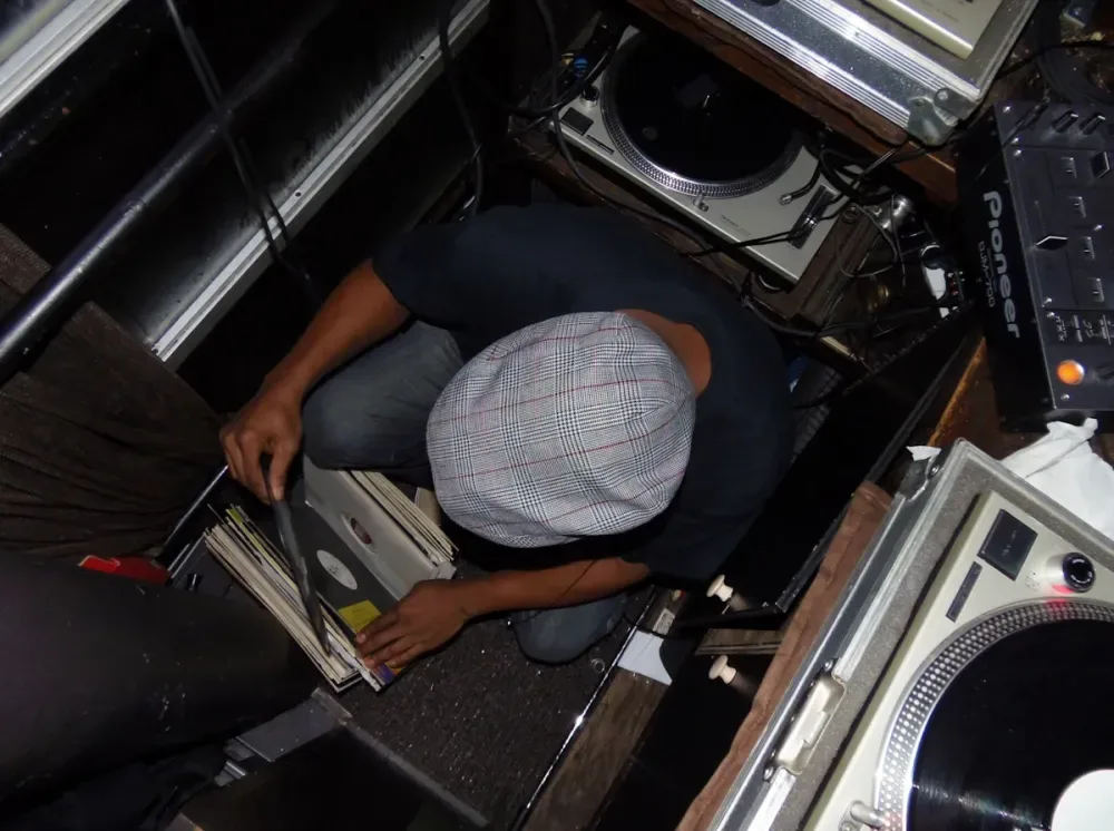 Turntable and vinyl records representing a genre-diverse indie record store