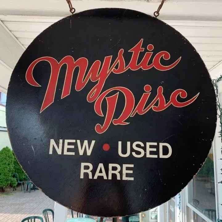 Mystic Disc storefront sign in Mystic, CT. New, Used, Rare records.